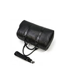 VUOTÍGA black leather weekender laying on white background 