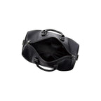 VUOTÍGA black leather duffel bag open on a white background