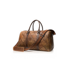 VUOTÍGA brown leather bag with a strap on a white background